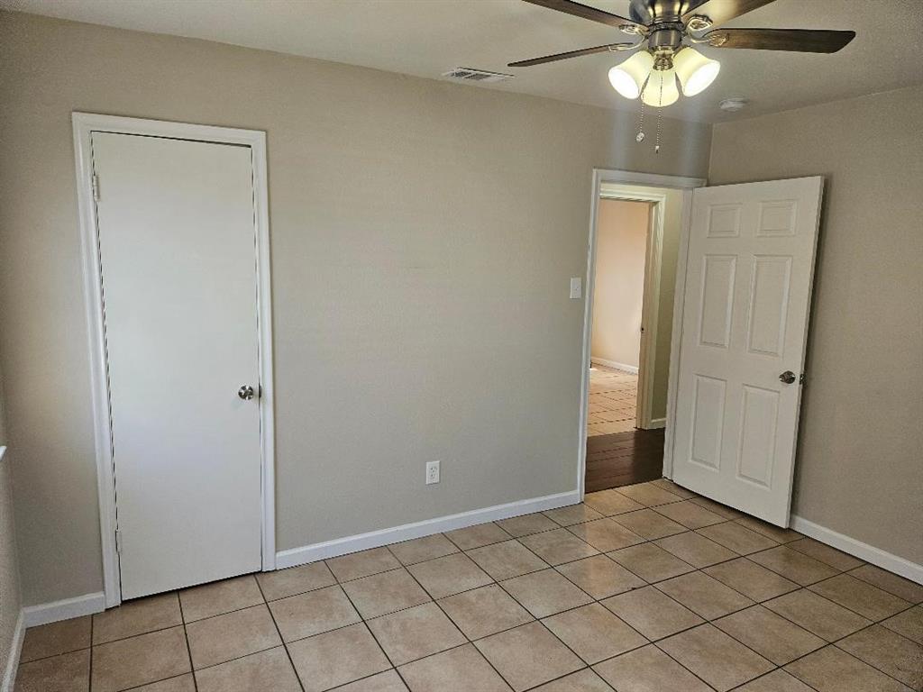 3511 Casa Ridge Drive Mesquite, TX 75150 - Photo 13 of 29 an empty room and chandelier fan
