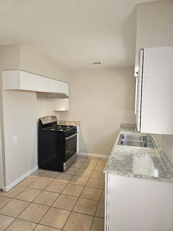 3511 Casa Ridge Drive Mesquite, TX 75150 - Photo 6 of 29 a kitchen with a granite countertop sink and a refrigerator