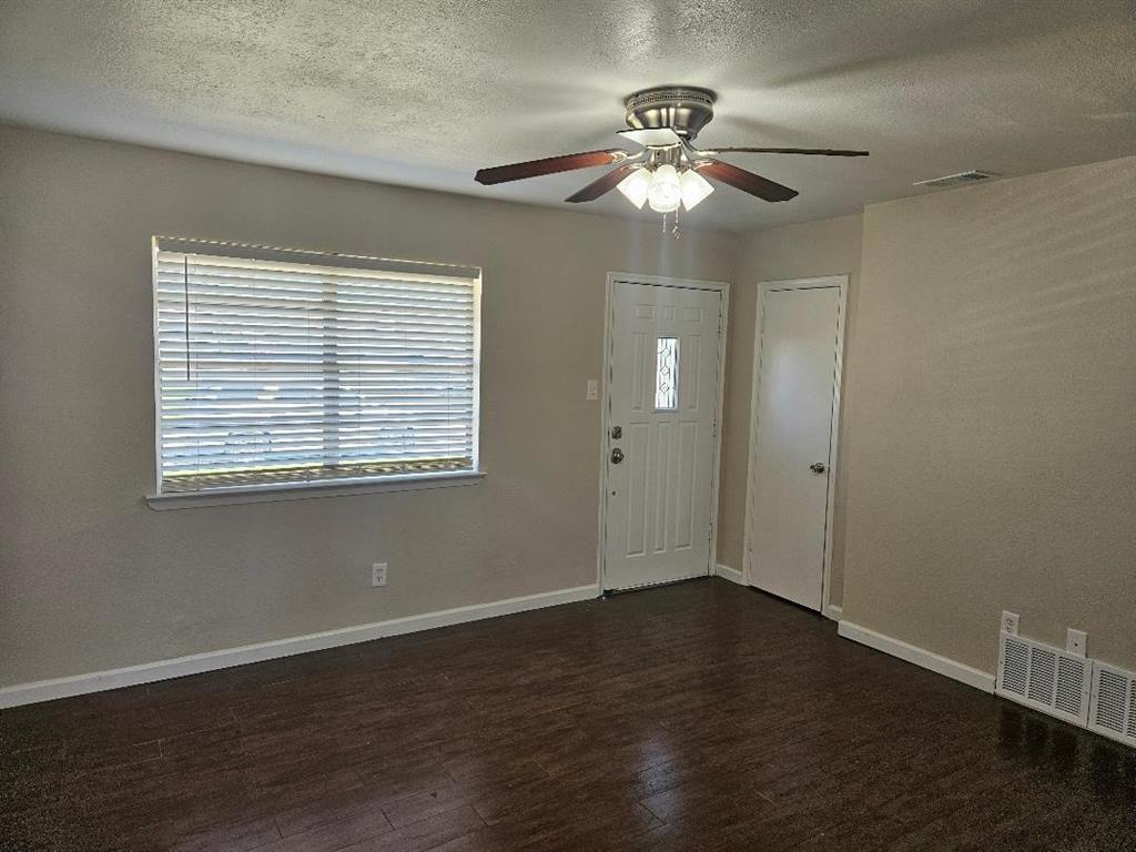 3511 Casa Ridge Drive Mesquite, TX 75150 - Photo 8 of 29 a view of an empty room with wooden floor and a window