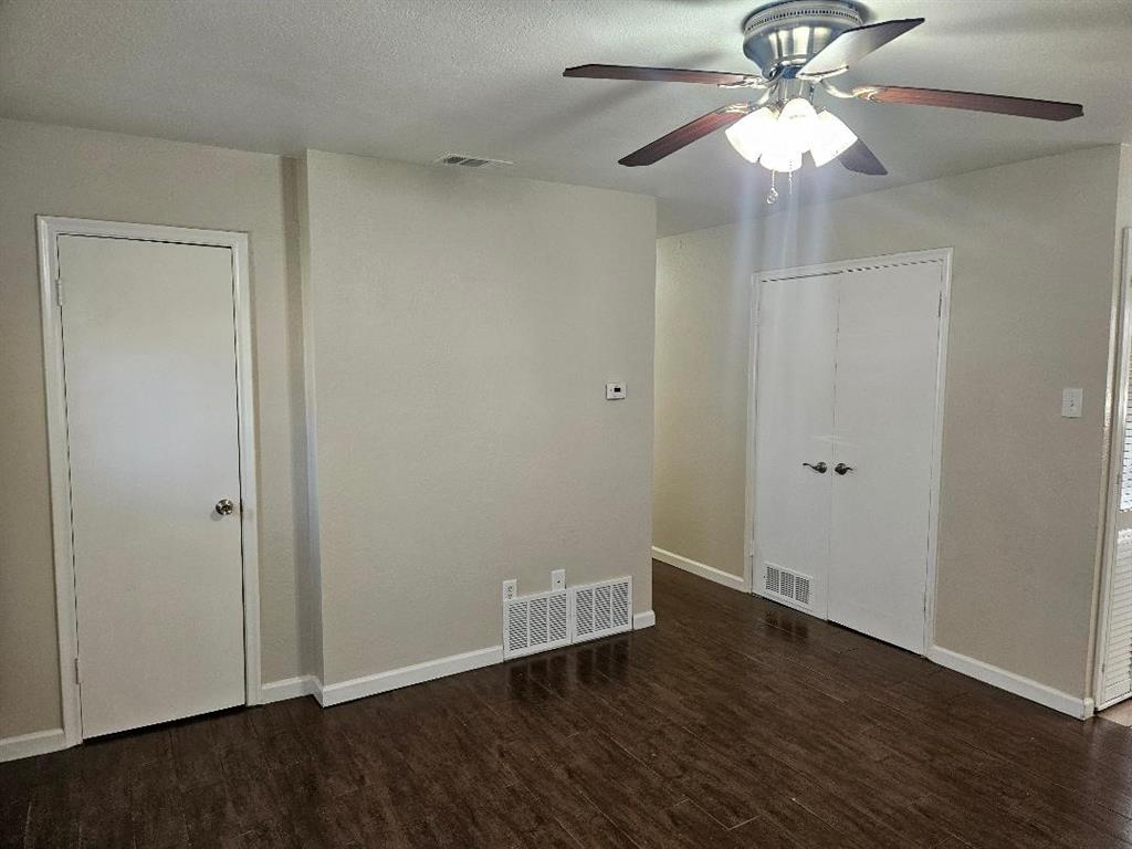 3511 Casa Ridge Drive Mesquite, TX 75150 - Photo 9 of 29 an empty room with wooden floor fan and window