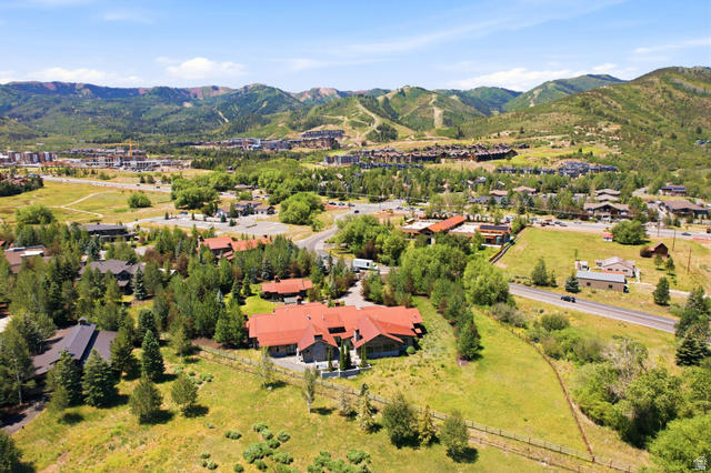 1575 Old Ranch Road Park City, UT 84098 - Photo 2 of 45 Expansive lot with lush green landscaping, mature trees, and a mountain backdrop