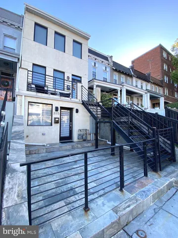 a view of a cafe with sitting area