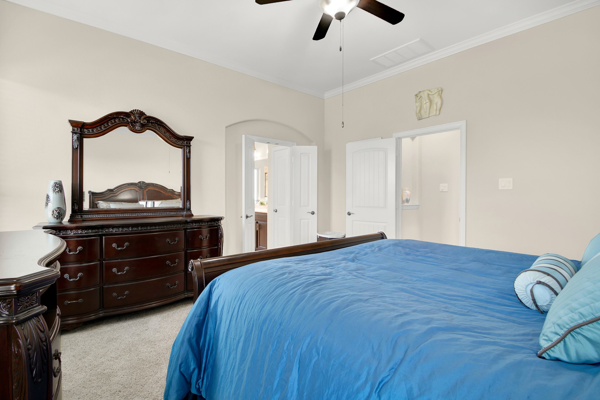 3864 Oakmist Bend Lane Spring, TX 77386 - Photo 18 of 38 a bedroom with a bed and a dresser