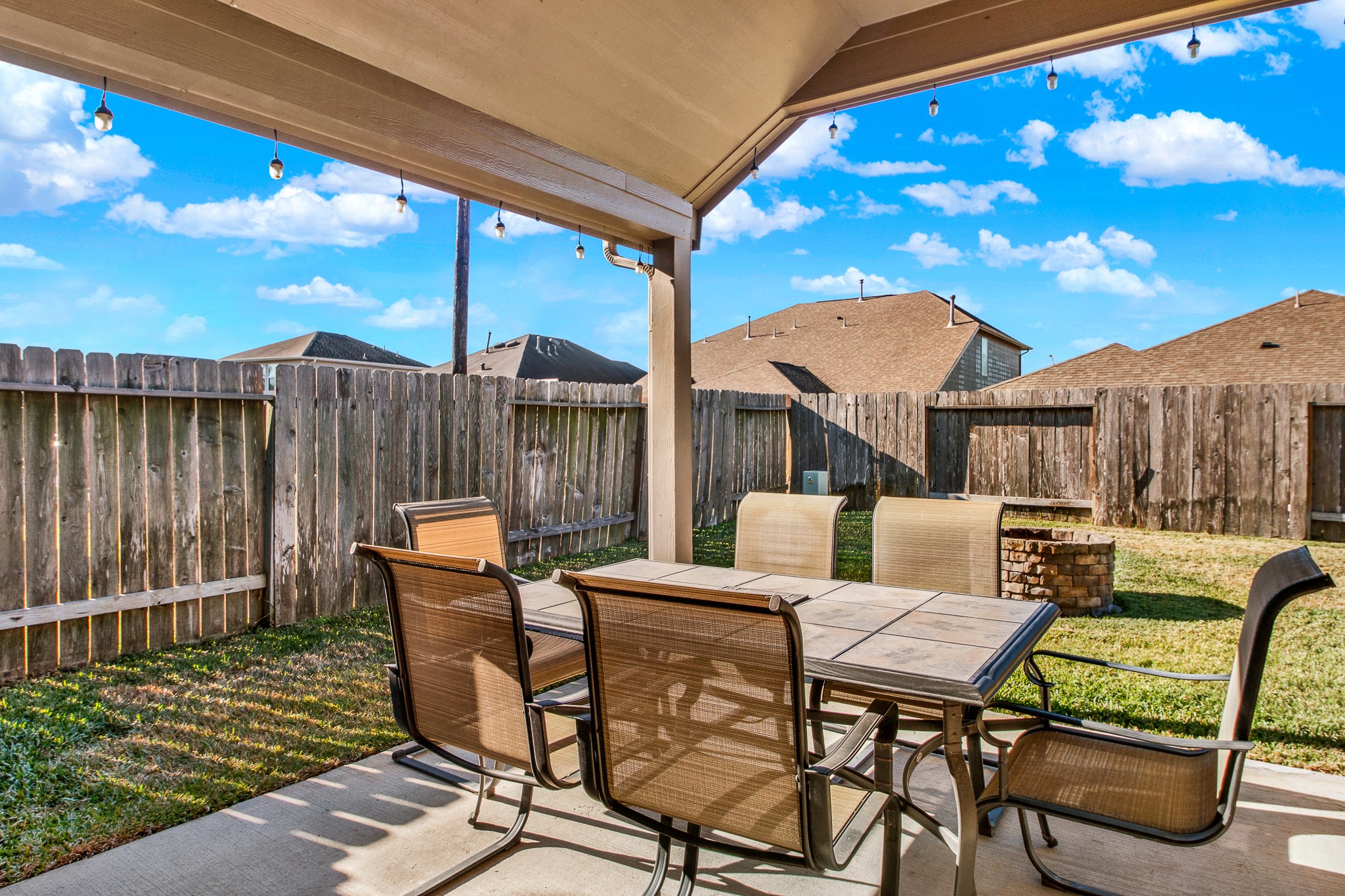 3864 Oakmist Bend Lane Spring, TX 77386 - Photo 31 of 38 a view of a patio with a dining table and chairs with wooden floor
