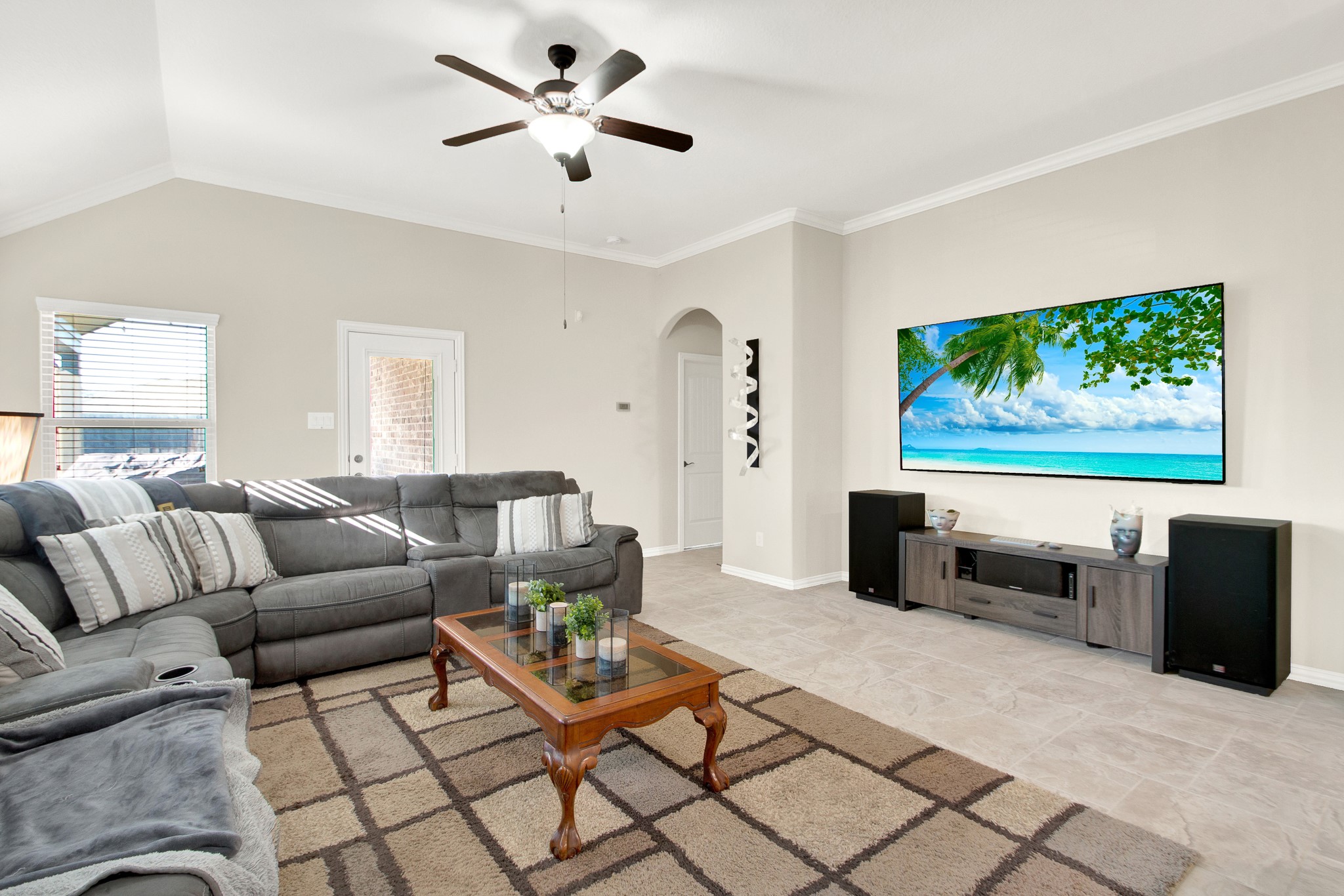3864 Oakmist Bend Lane Spring, TX 77386 - Photo 8 of 38 a living room with furniture and a flat screen tv