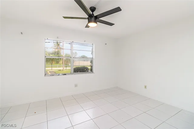 a view of an empty room and window