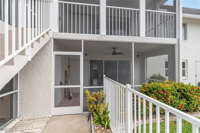 a view of a house with backyard sitting area and garden