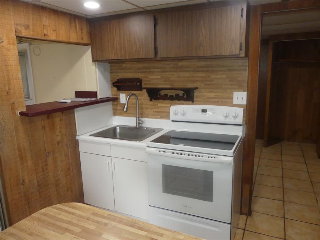 4725 Southwest 65th Avenue Davie, FL 33314 - Photo 12 of 14 a kitchen with a stove and a refrigerator