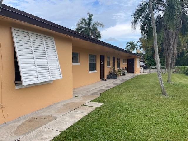4725 Southwest 65th Avenue Davie, FL 33314 - Photo 4 of 14 a backyard of a house with table and chairs