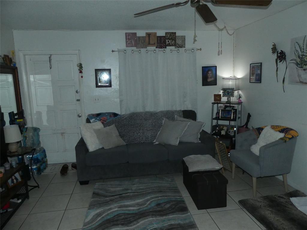 4725 Southwest 65th Avenue Davie, FL 33314 - Photo 6 of 14 a living room with furniture and a mirror