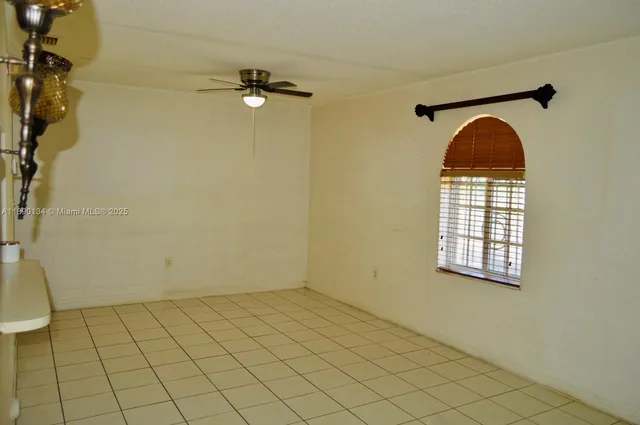 a view of an empty room and a window