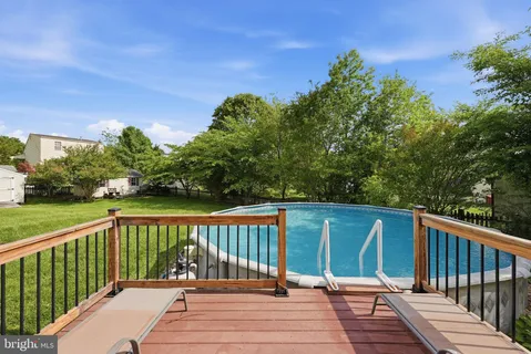 a view of deck with wooden floor and outdoor seating