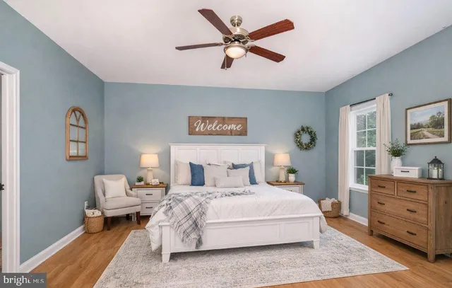 a view of an empty room and wooden floor