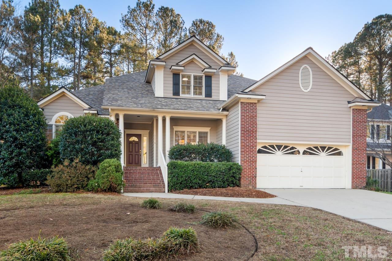 2116 Fountain Ridge Road Chapel Hill, NC 27517 - Photo 1 of 27 a front view of a house with a yard and garage