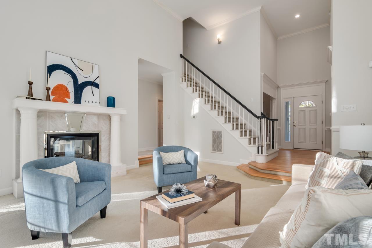 2116 Fountain Ridge Road Chapel Hill, NC 27517 - Photo 2 of 27 a living room with furniture and a fireplace