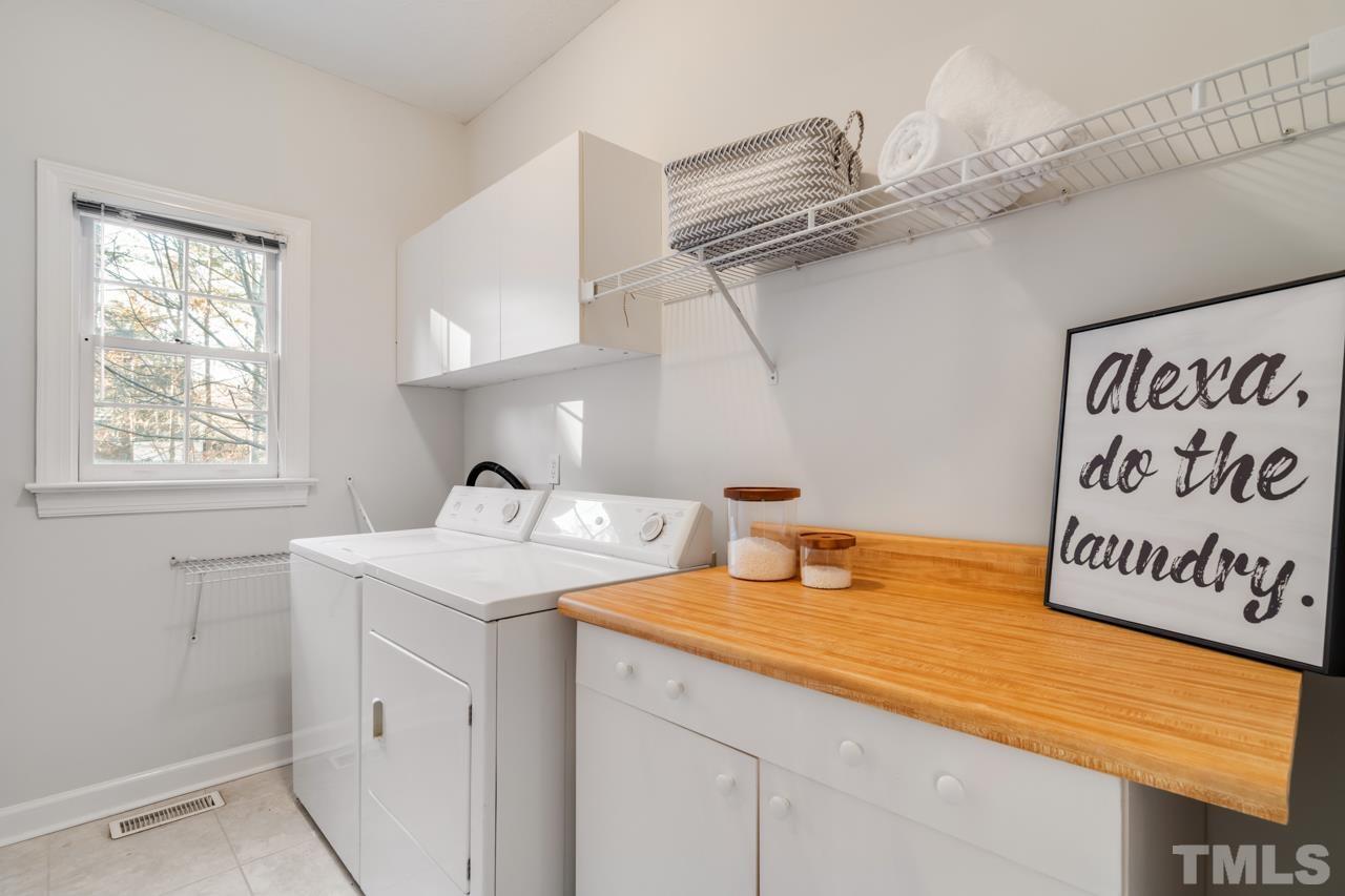 2116 Fountain Ridge Road Chapel Hill, NC 27517 - Photo 12 of 27 a kitchen with a sink and a window