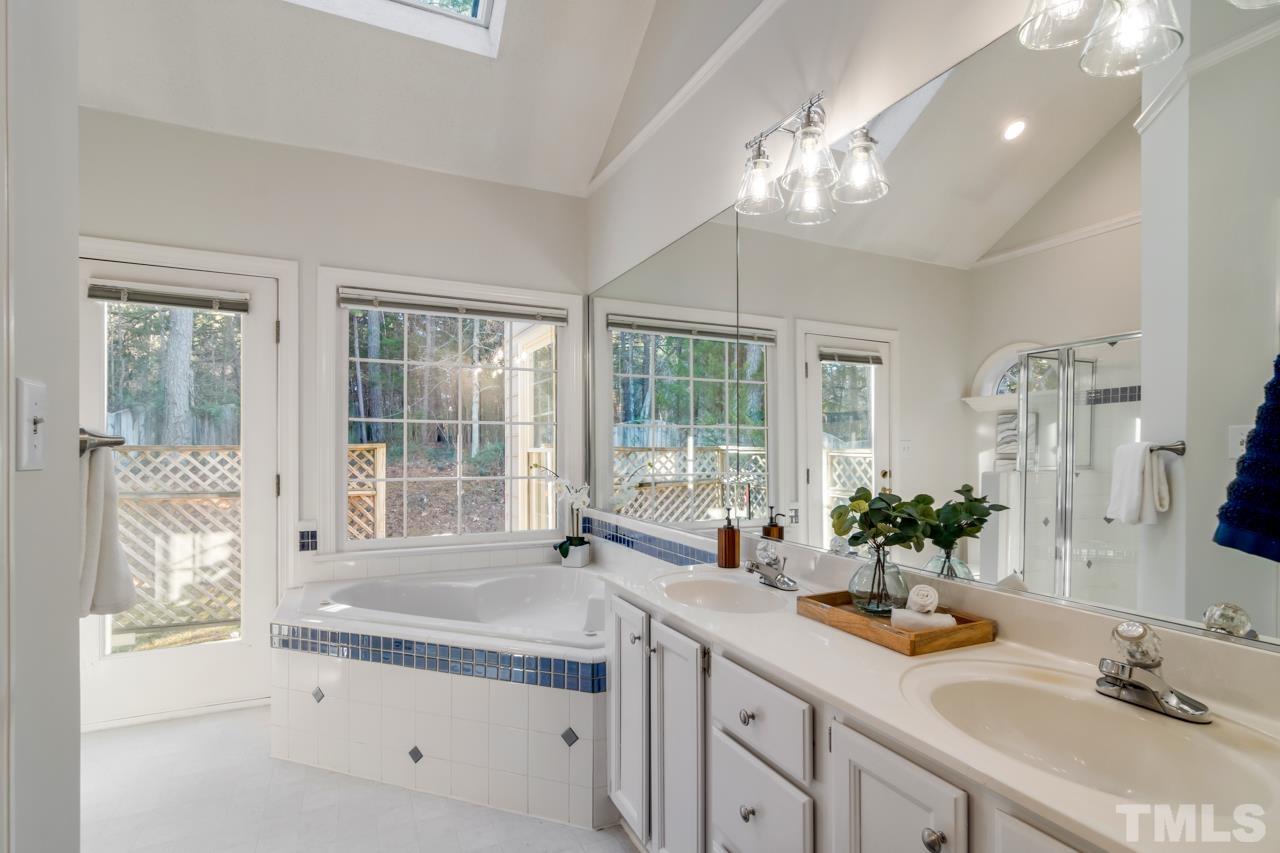 2116 Fountain Ridge Road Chapel Hill, NC 27517 - Photo 17 of 27 a bathroom with a sink and large mirror