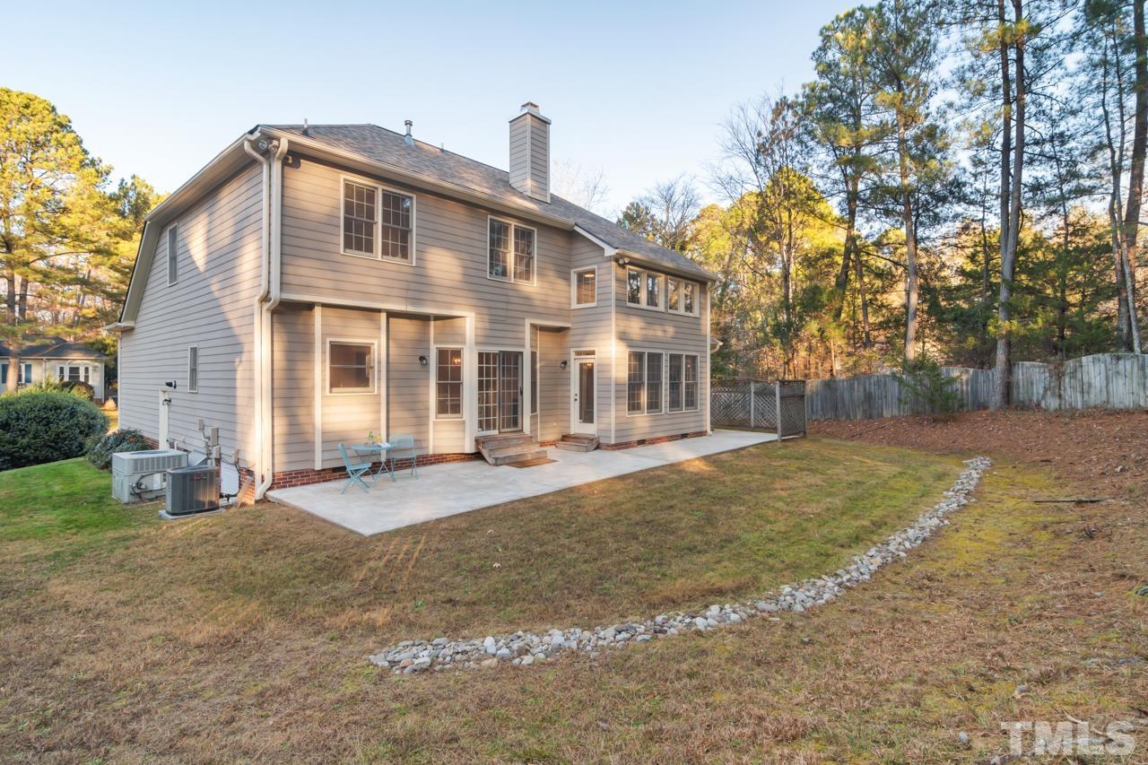 2116 Fountain Ridge Road Chapel Hill, NC 27517 - Photo 25 of 27 a front view of a house with a yard and garage