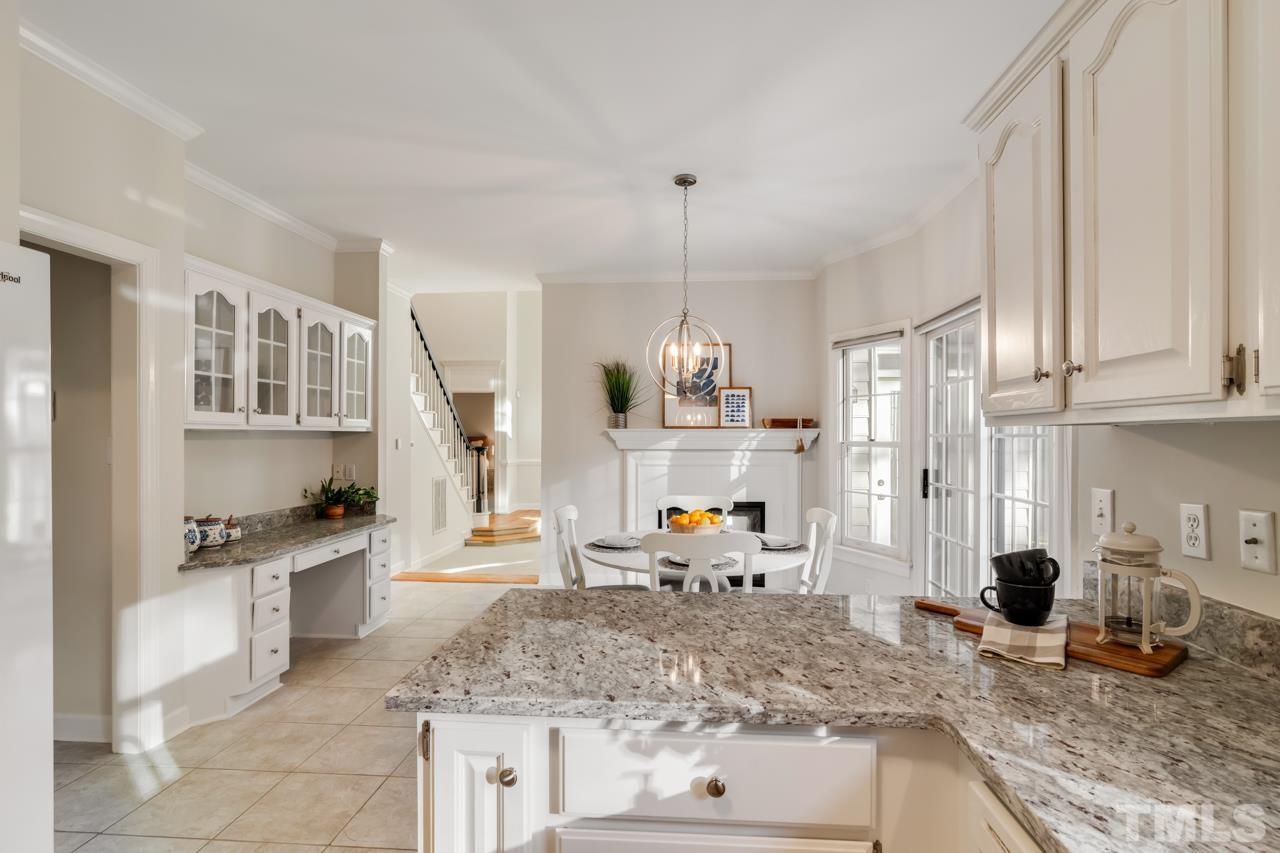 2116 Fountain Ridge Road Chapel Hill, NC 27517 - Photo 6 of 27 a kitchen with stainless steel appliances granite countertop a sink stove and refrigerator