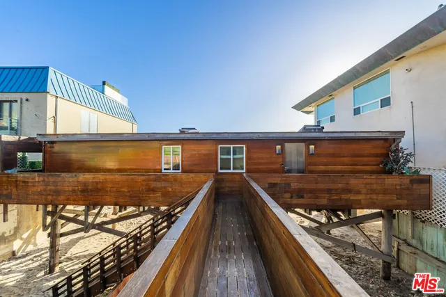 a view of a balcony with two chairs