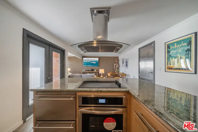 a bedroom with a bed couch and a window