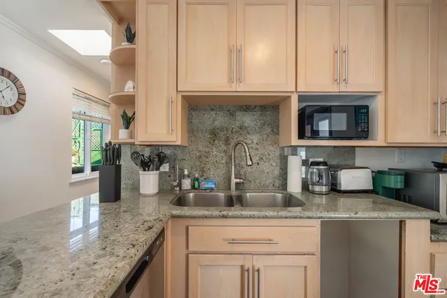 a bedroom with a bed and a mirror