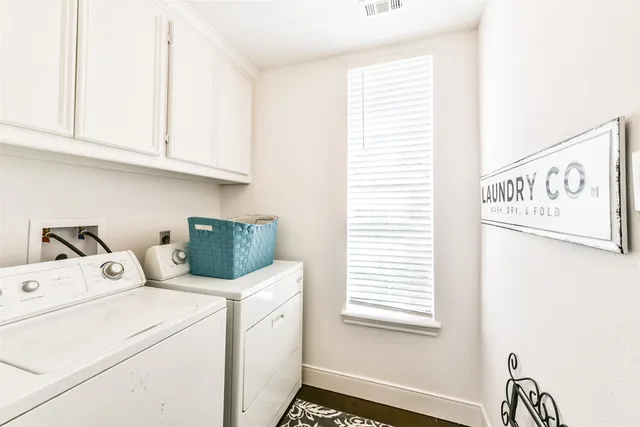 a view of a livingroom with furniture and a floor to ceiling window