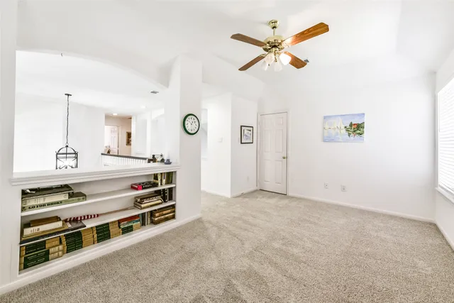 a bed room with a bed and a potted plant