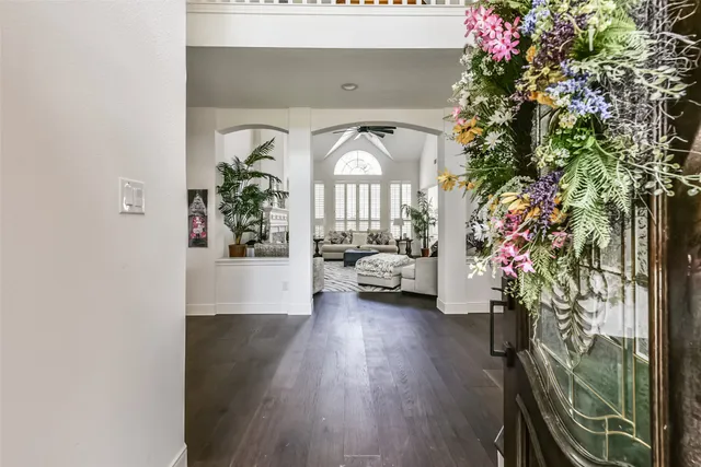 an entryway with a flower pot and a window
