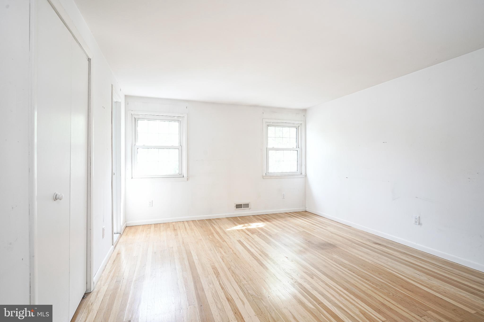 152 Kelly Driver Road Laurel Springs, NJ 08021 - Photo 23 of 30 an empty room with wooden floor and windows