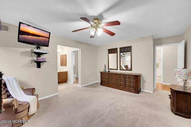 a view of work space with furniture and windows
