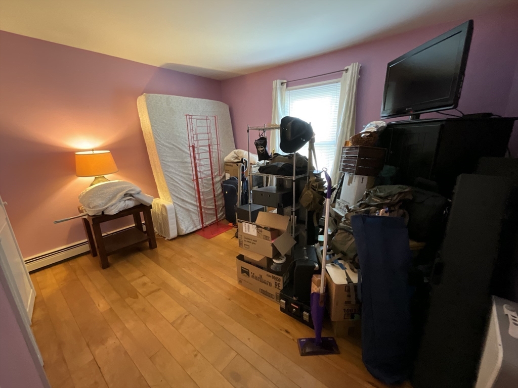 47 South Cross Road Gill, MA 01354 - Photo 25 of 42 a room with gym equipment and a flat screen tv