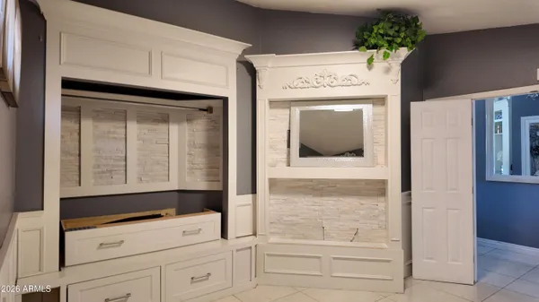 a view of kitchen with wooden floor and cabinet