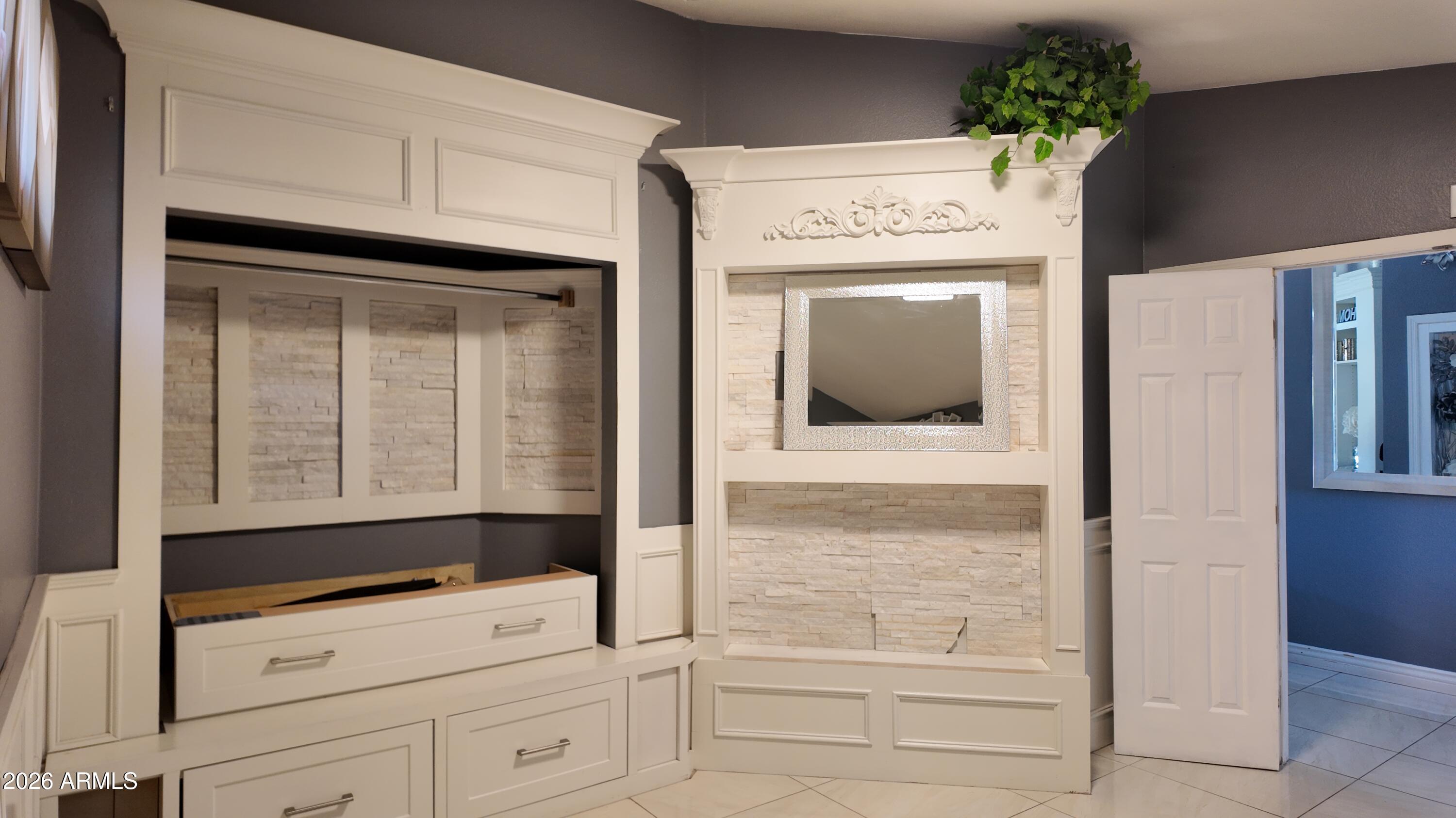 8429 West Granada Road Phoenix, AZ 85037 - Photo 6 of 12 a view of kitchen with wooden floor and cabinet