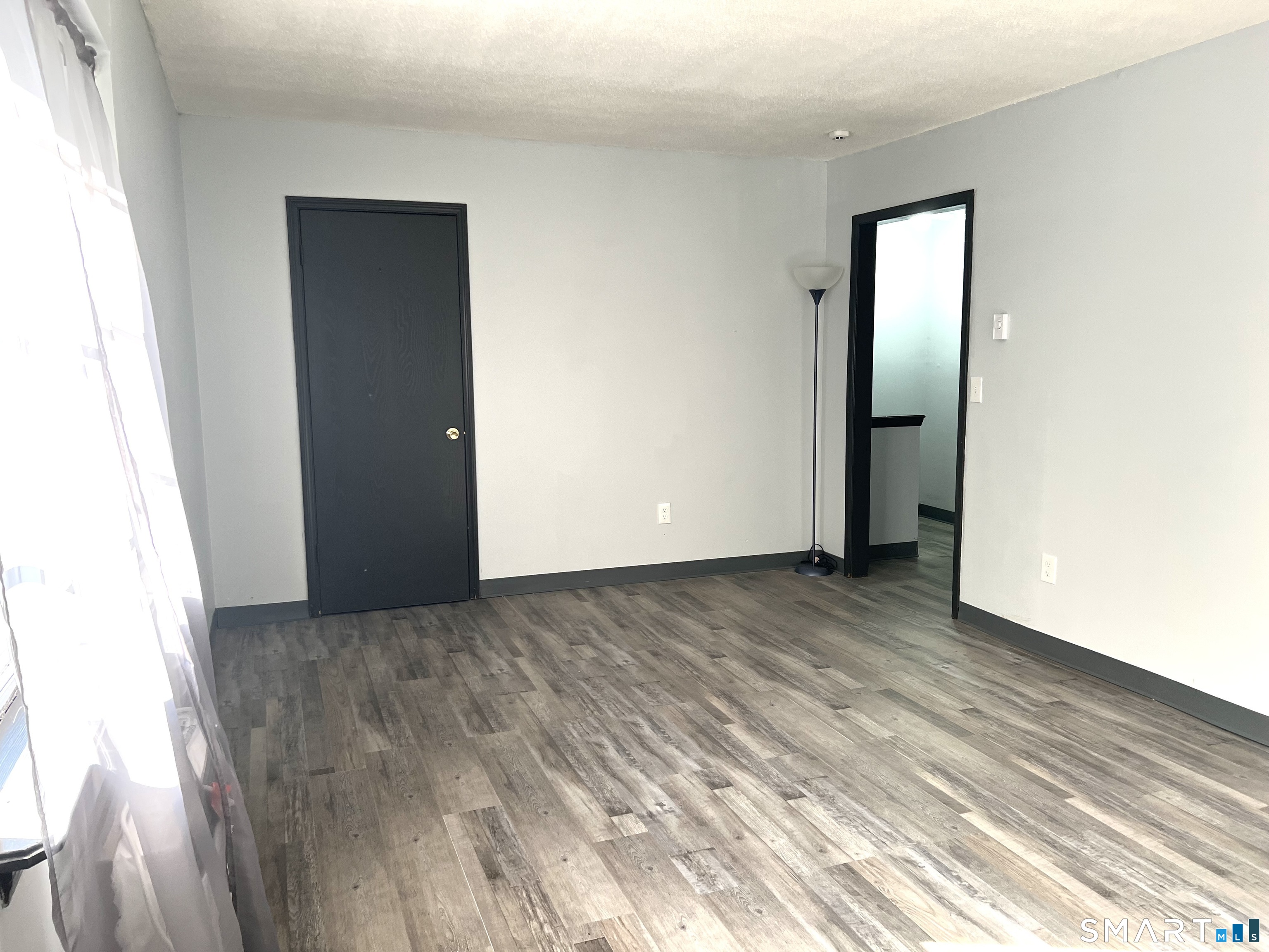 35 Mountain Village Road, Unit 30 Waterbury, CT 06706 - Photo 6 of 15 Second view of living room with a closet.