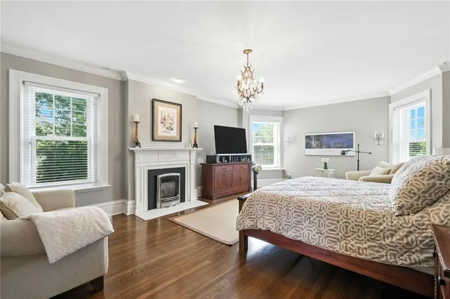 a living room with furniture fireplace and flat screen tv