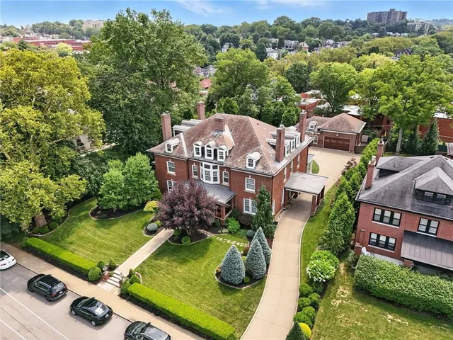 an aerial view of a house with a garden