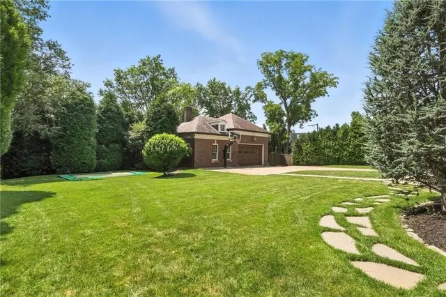 a backyard of a house with lots of green space
