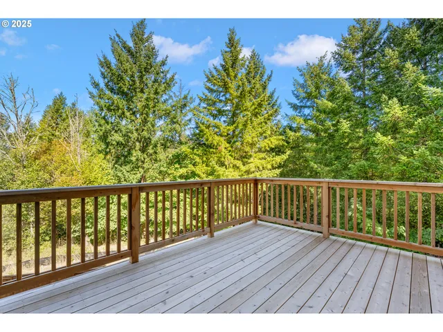 a view of balcony with wooden floor