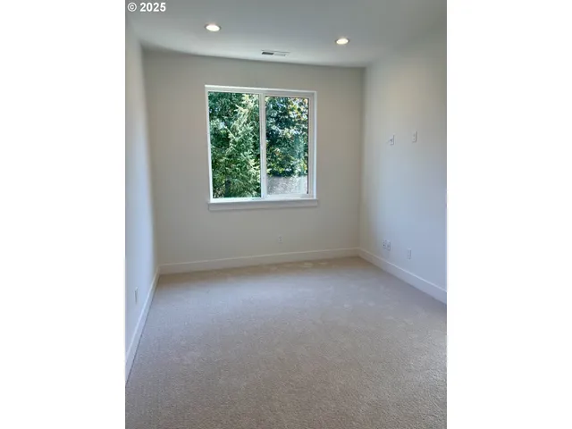 a view of a room that has a window in it