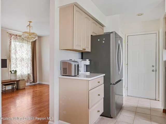 a kitchen with a refrigerator and cabinets