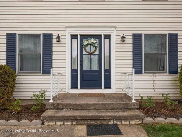 a view of a house with windows and plants