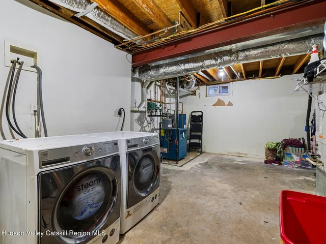 a view of storage and utility room with washer and dryer
