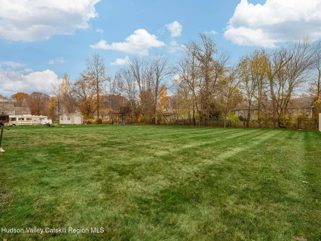 a view of a field with trees