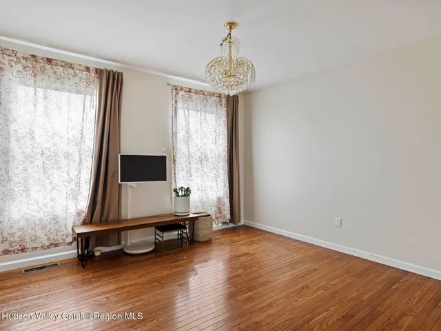 a view of a room with gym equipment and a large window