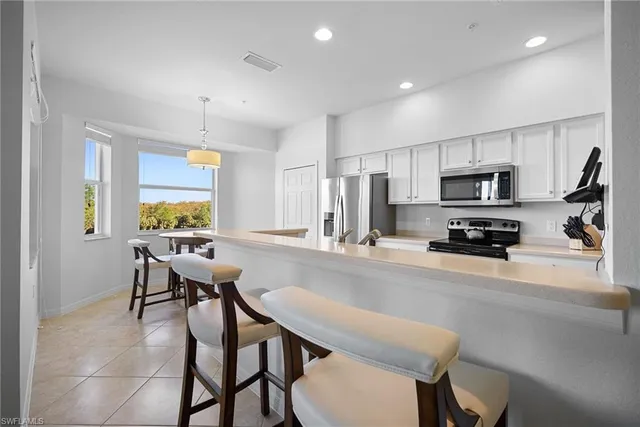 a living room with furniture and a painting