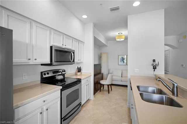 a view of kitchen with furniture and wooden floor