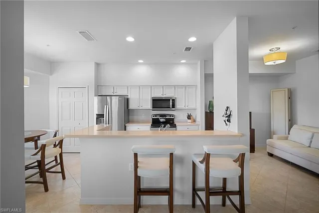 an aerial view of multiple houses with yard