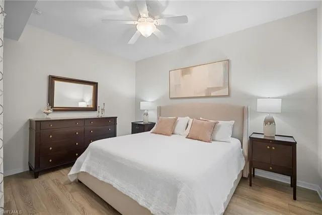 a view of a patio with a table and chairs under an umbrella