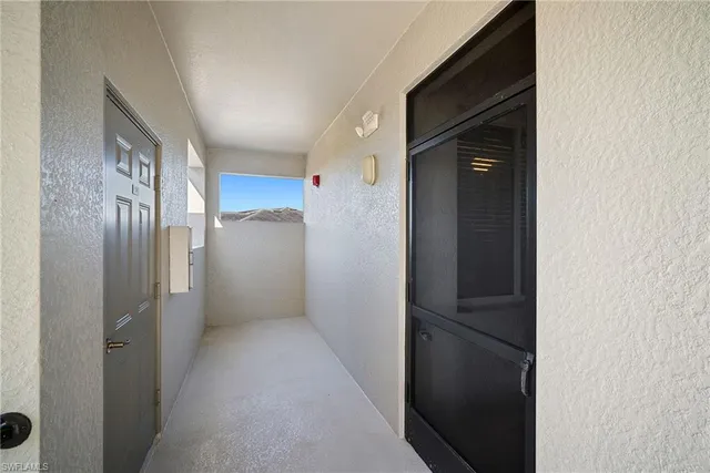 a view of a balcony with a swimming pool